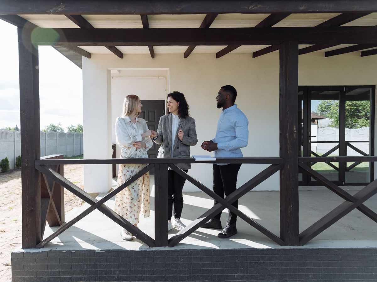 Estate agent showing a new home to clients